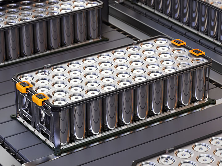 Close-up view of a production line of lithium-ion battery packs in a manufacturing facility