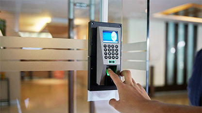 Electronic door control device, young man pushing down the electronic control to access the door